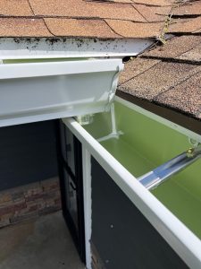 guttters shown on a house with a new shingle roof